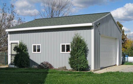24'x24'x10' pole barn with a 16'x8' garage door