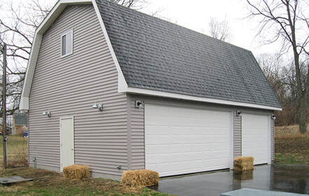 Gambrel style barn sized 30'x40'x10' with 1 9'x8' and 1 16'x8' garage doors