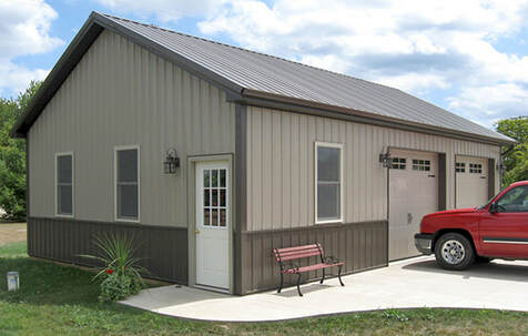 2 car garage doors with 1 entry door in a 24'x40'x9' with a 6/12 roof and 2 9'x8' carriage style garage doors.