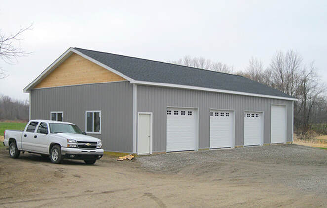 4 garage door with 1 entry door pole barn sized 32'x60'x12' with 3 9'x8' and 1 9'x10' garage doors