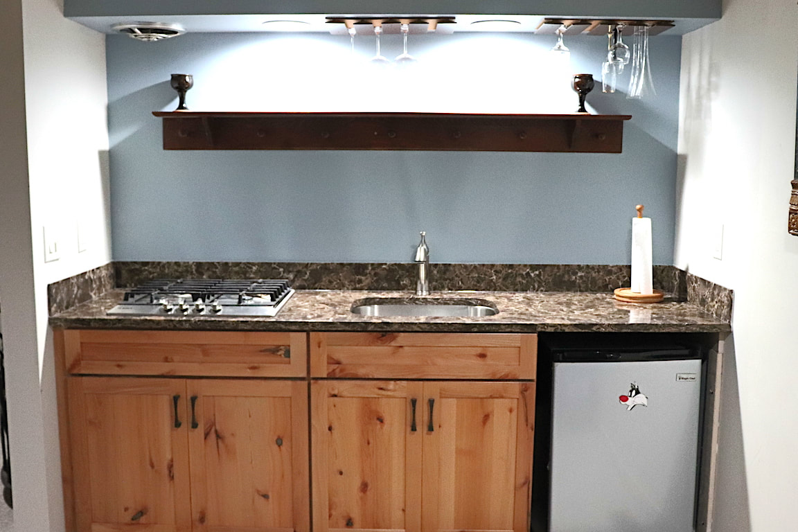 Gallery #32 - Kraftmaid Vantage cabinetry in Hickory basement wet bar