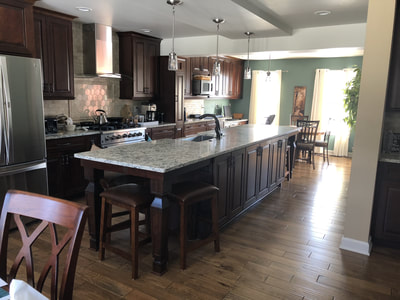 Gallery #15 - semi-custom Kraftmaid Vantage cabinetry large dark wood stain kitchen with large center island
