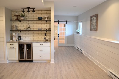 Gallery #33 - Merillat Classic white cabinetry for basement bar and entertainment space.